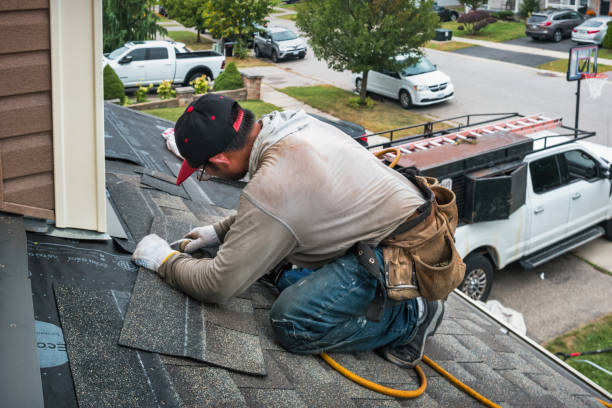 Professional Roof Replacement technician working in Southport, IN